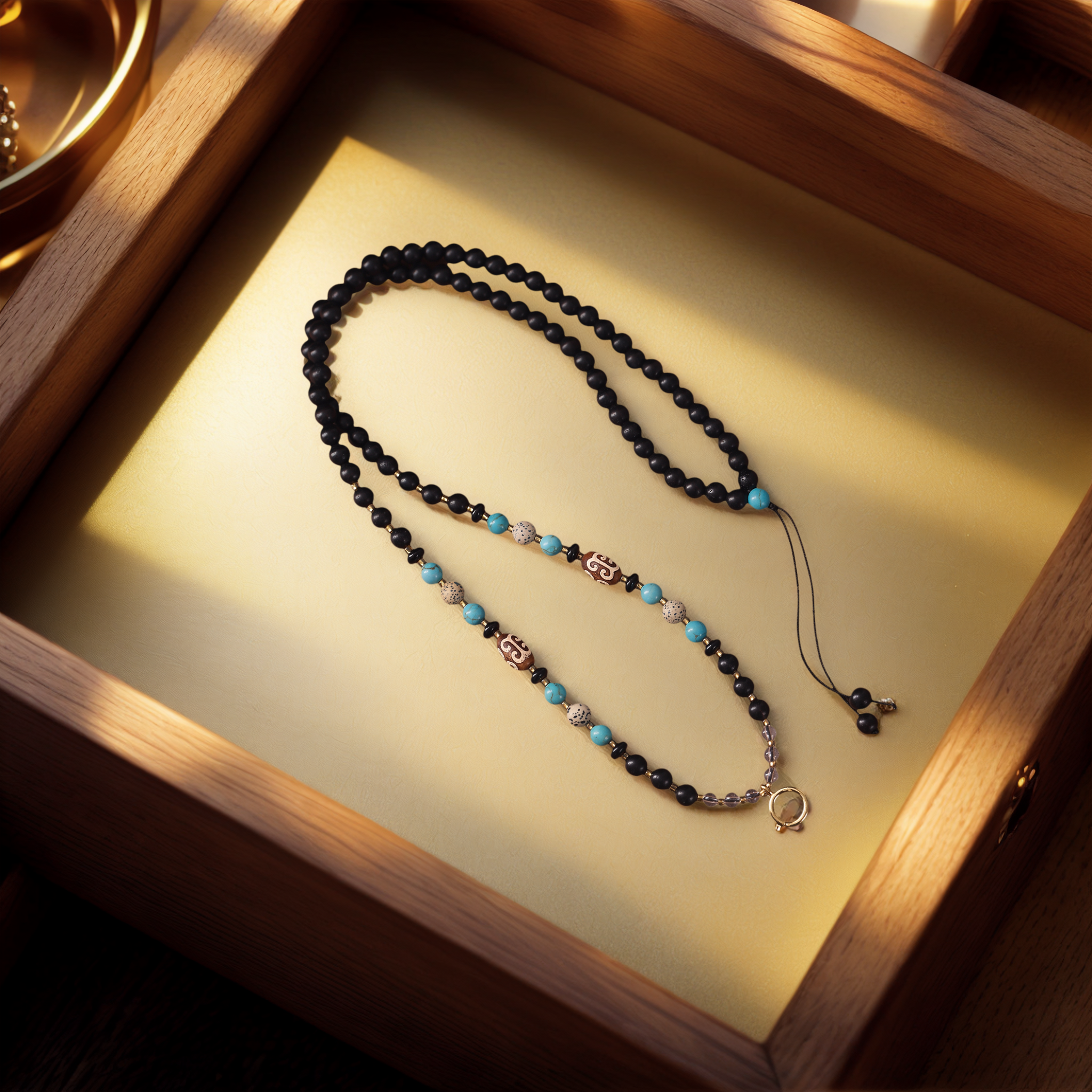 Natural Ebony & Beeswax Amber Pendant Chain — lifestyle view