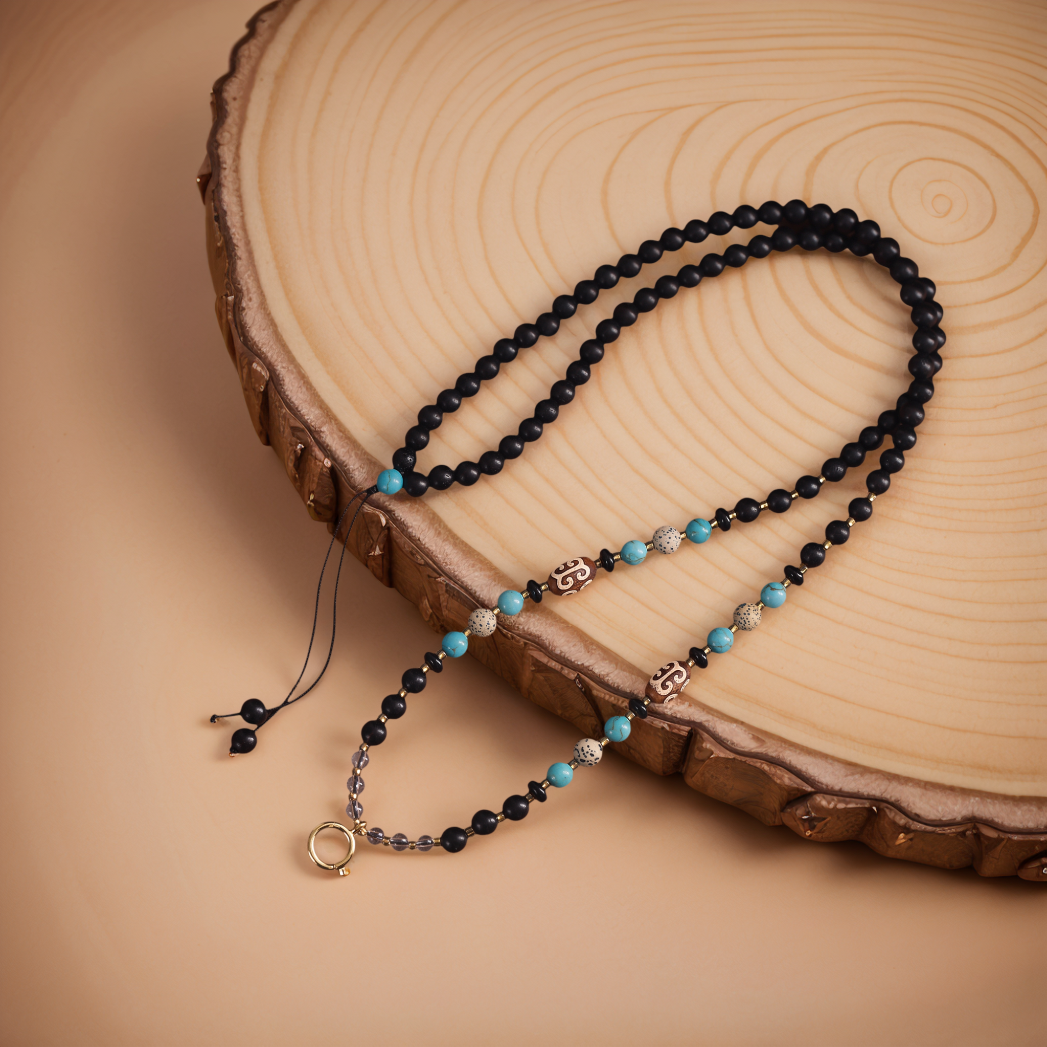 Natural Ebony & Beeswax Amber Pendant Chain — lifestyle view