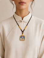Pendant shown worn to demonstrate size and shape