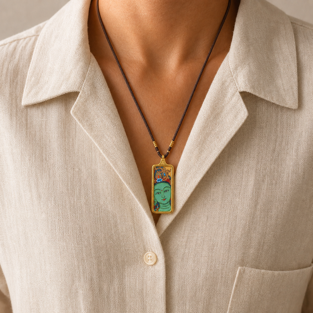 Eastern Luck Green Tara mini Tibetan thangka pendant — fine cord worn on ivory linen shirt — image 6 of 10