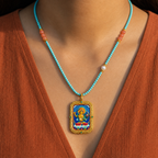 Manjushri hand-painted Tsatsa Thangka pendant with turquoise and coral necklace