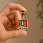 Samantabhadra titanium steel pendant held in hand for scale